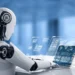 A humanoid robot with a sleek design sits at a desk, interacting with a futuristic, transparent digital interface. Multiple holographic screens display various data, charts, and world maps against a blurred blue background, highlighting AI companies to invest in within this high-tech environment. | LESSINVEST