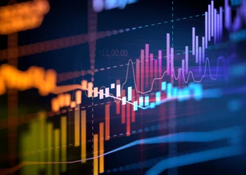 A colorful display of various financial graphs and charts with multiple lines, bars, and numerical indicators. The image illustrates data trends, fluctuations, and market analysis with vibrant hues against a dark background, symbolizing passive income activities. | LESSINVEST