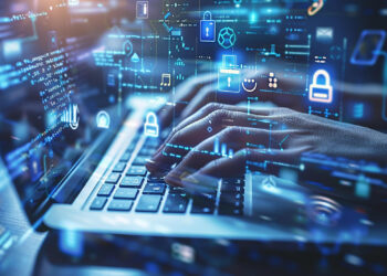 Hands typing on a laptop keyboard with holographic digital symbols, including locks and data streams, overlaying the scene, evoke cybersecurity and data protection concepts. This visual underscores the importance of knowing how to protect yourself online when gambling for safe digital exploration. | LESSINVEST