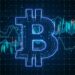 Glowing Bitcoin symbol overlaid on digital financial charts with candlestick and line graphs.